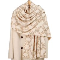 Beige and ivory chain print scarf with an allover interlocking link pattern draped on a neutral background