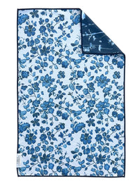 Floral patterned towel with blue flowers on a white background