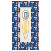 Good Juju Ink Antique Bow Metal Clip Bookmark with blue bow artwork and gold-tone finish in navy blue patterned gift packaging