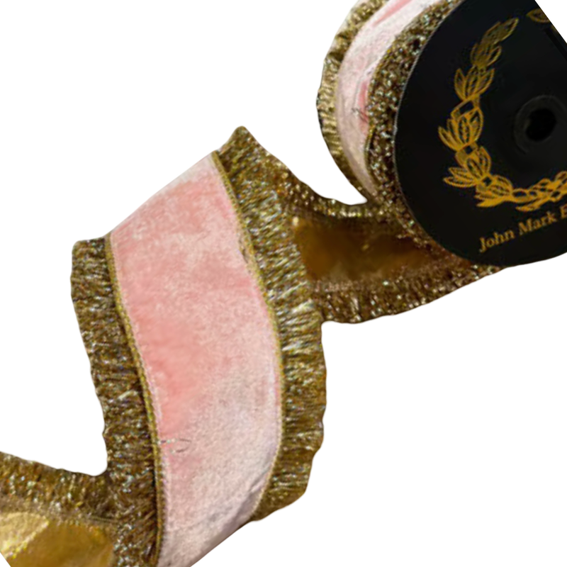 JME 4-inch pink velvet ribbon with wide gold fringe along both edges, curled beside a black spool to show its metallic gold reverse.
