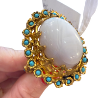 Made in the Deep South 1970s vintage cocktail ring with oversized white oval cabochon and turquoise-blue accents