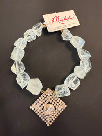 ohmeredith Made in the Deep South vintage rhinestone brooch necklace with oversized translucent aqua quartz beads worn with a blue top