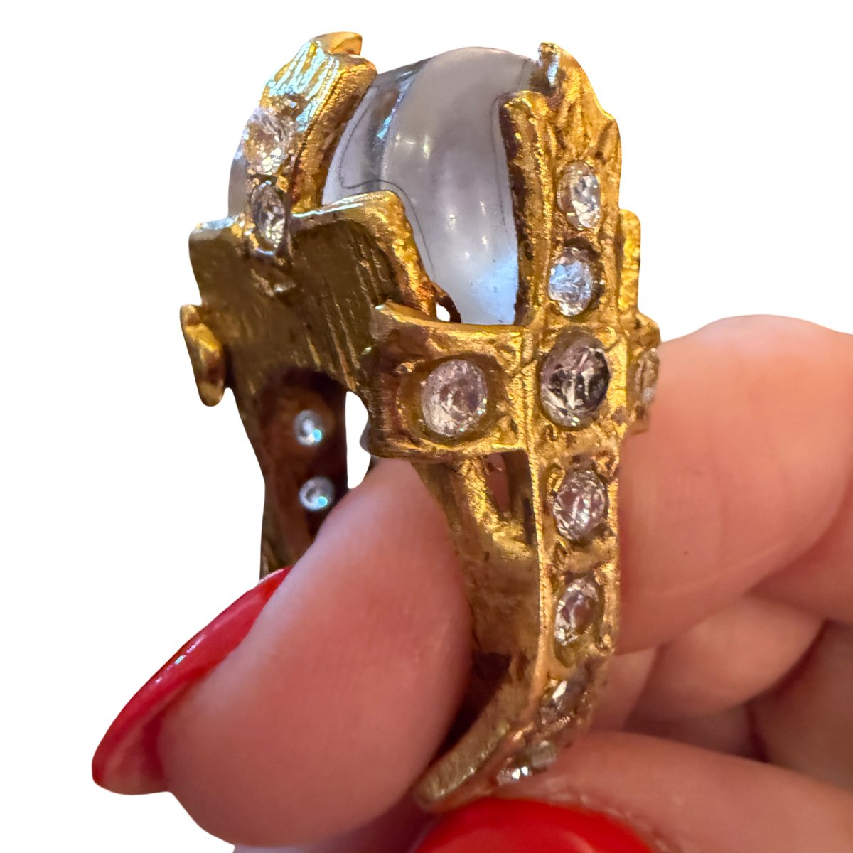 Made in the Deep South vintage ring with a gray cabochon and gold-tone cross set with clear faceted accents.