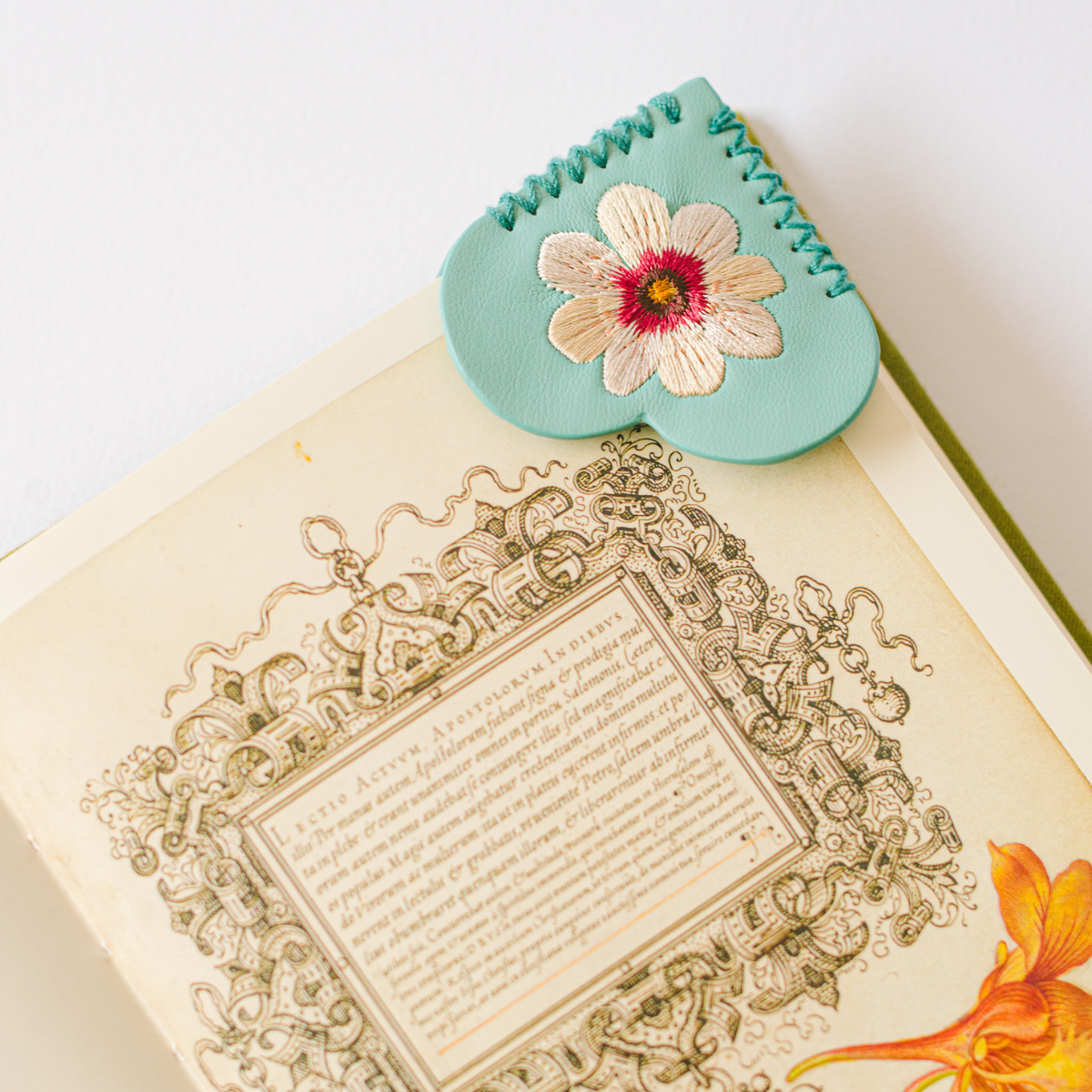 Mint green vegan leather heart corner bookmark with pink and white embroidered flower by Good Juju Ink