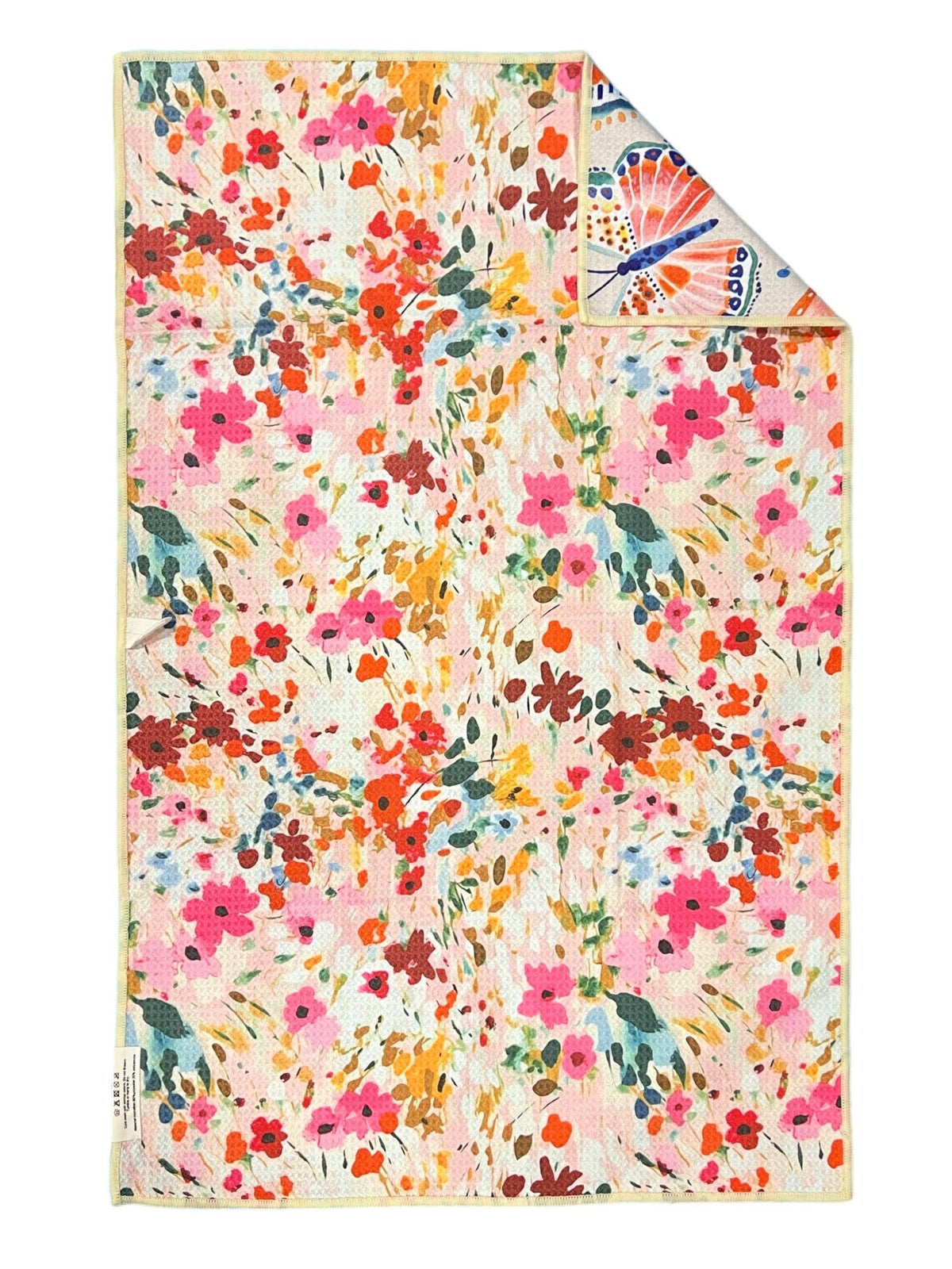 Pink and multicolored floral reverse of the Crae.Home Floatie reversible waffle-weave microfiber hand towel