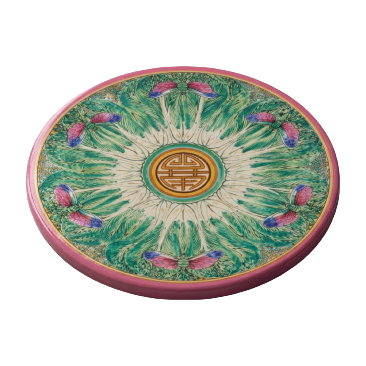 Round sandstone coaster with a pink border, green bok choy-inspired pattern, and dragonfly details on a marble surface.