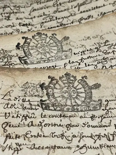 Close-up of historical text with decorative elements on an old document