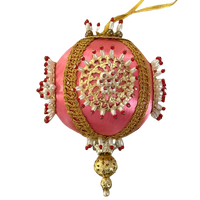 Vintage pink satin-thread ornament with gold-tone medallions, pearl-look beads tipped in red, metallic braid, and an ornate gold-tone drop.