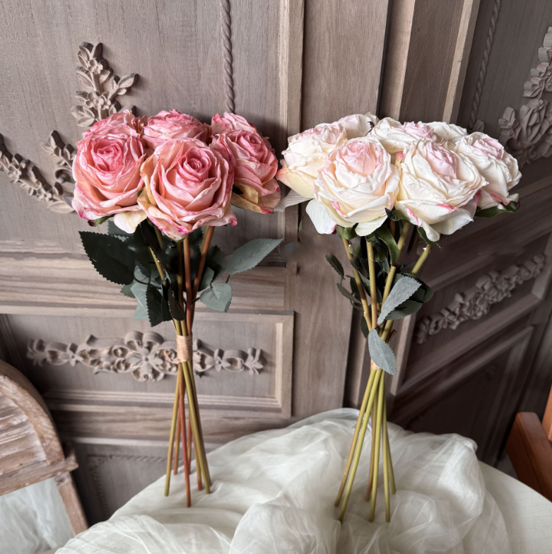 Burnt orange and deep red vintage-style faux rose bouquet with seven full rose stems and leaves