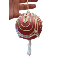 beautiful vintage pink satin Christmas ornament with cascading gold trim, faux pearl embellishments, and a decorative beaded tasse