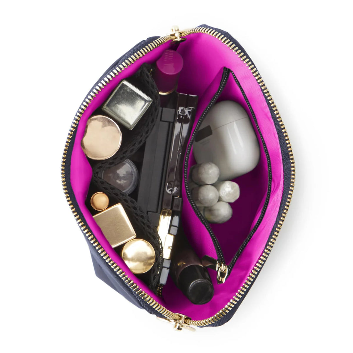 Pink makeup bag with various cosmetic items on a white background