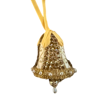 Vintage gold and ivory bell ornament with sequins, pearl-look trim, a yellow ribbon loop, and a dangling teardrop.