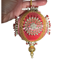 Vintage pink satin-thread ornament with gold-tone medallions, pearl-look beads tipped in red, metallic braid, and an ornate gold-tone drop.