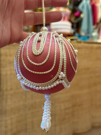 beautiful vintage pink satin Christmas ornament with cascading gold trim, faux pearl embellishments, and a decorative beaded tasse