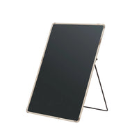 Black electronic display board with stand on a white background