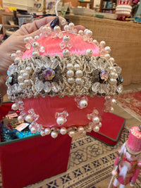 one-of-a-kind vintage pink satin Christmas ornament featuring sparkling rhinestones, faux pearls, silver trim, and intricate handmade details.