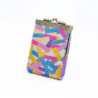 Cathayana Confetti Brocade RFID card holder with colorful pink, blue, yellow, and green geometric pattern and antique-style kiss-lock closure.