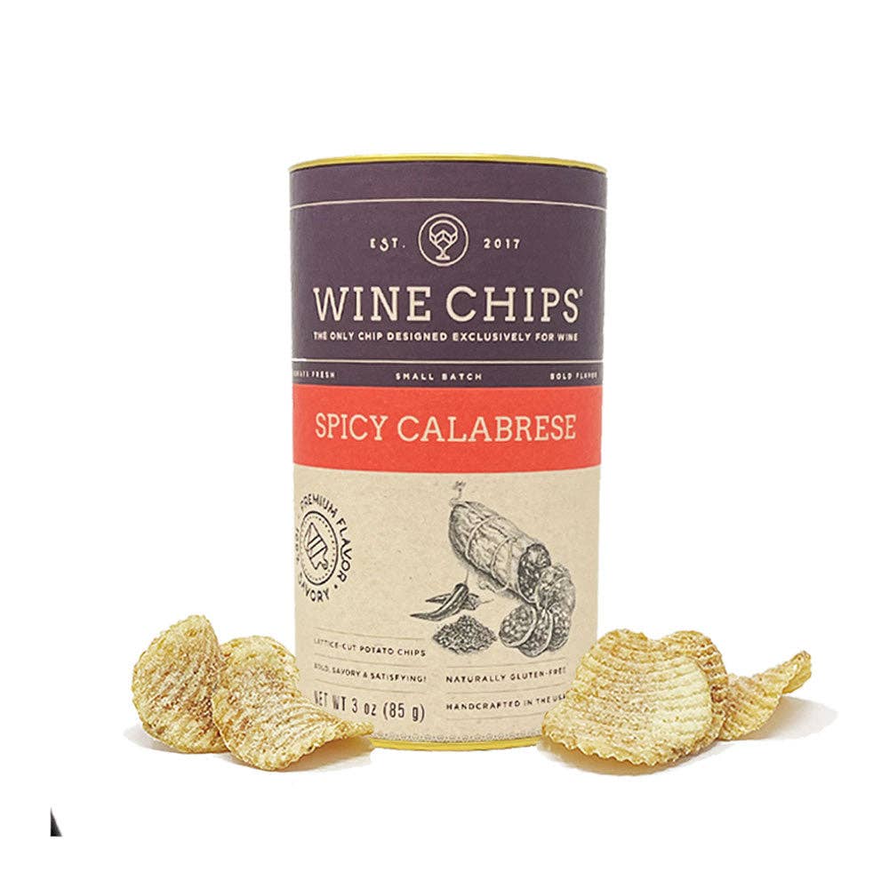 A canister of Wine Chips Spicy Calabrese potato chips on a white background, with several loose chips arranged in front of the container.