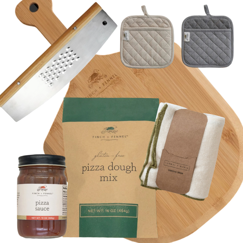 Collection of pizza-making items including a wooden cutting board, pizza dough mix, pizza sauce, and pot holders on a white background.