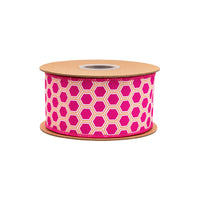 Spool of pink ribbon with geometric pattern on a white background
