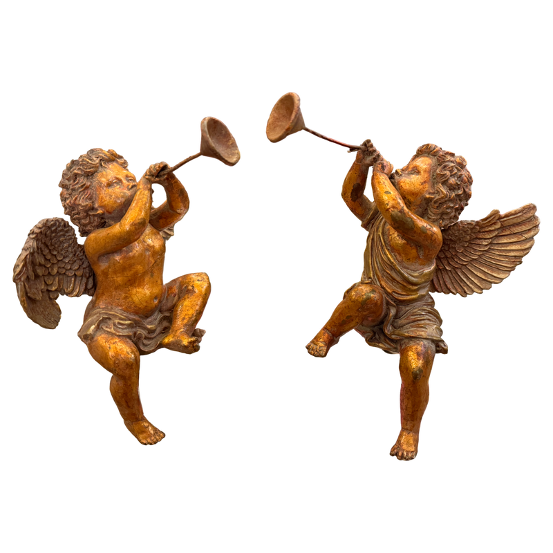 vintage cherub statues, cherub trumpet figures, angel figurines vintage, gilt cherub decor, European vintage decor, classical angel statues, sculptural home decor, collected interior decor, vintage angel pair, mantel decor accents, bookshelf styling decor