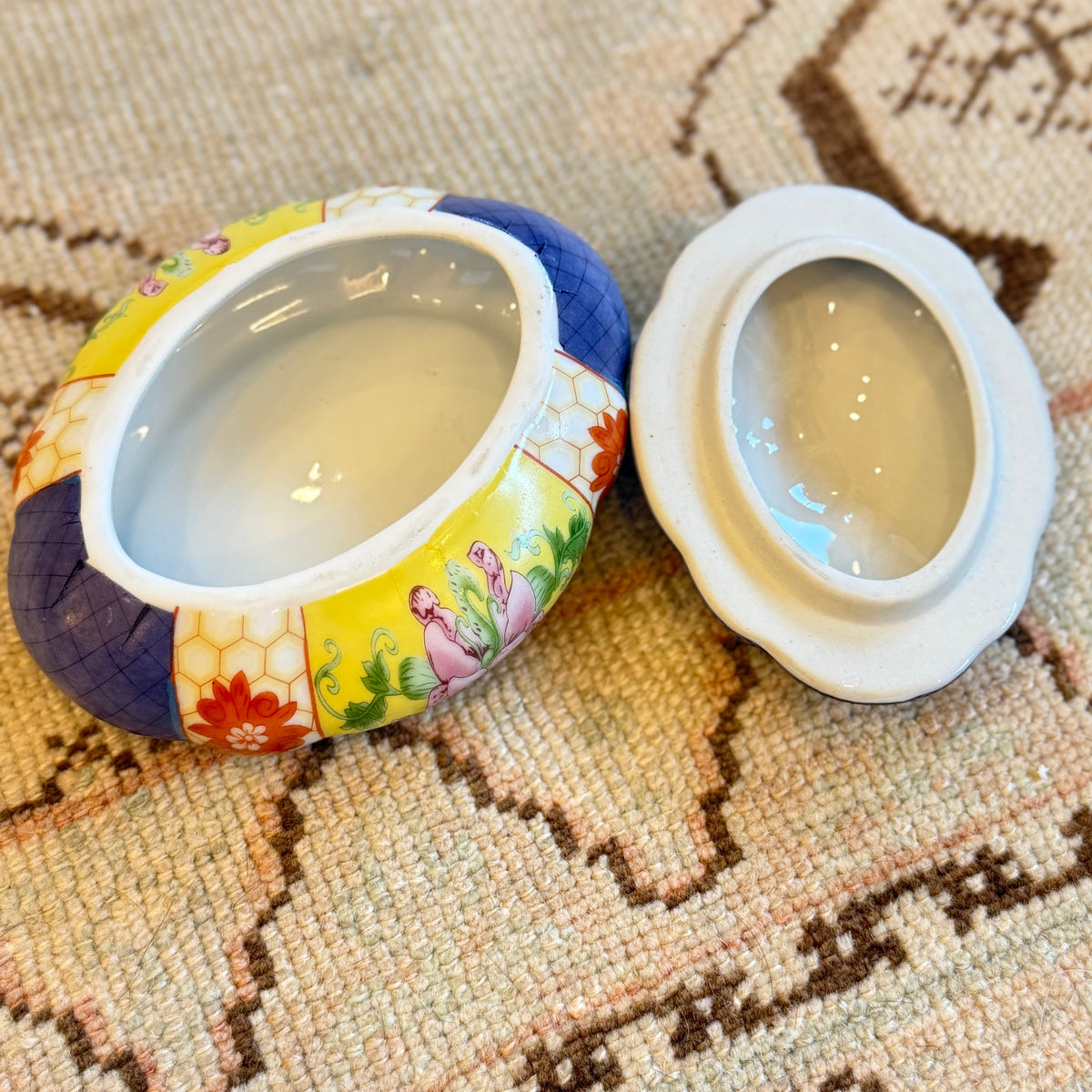 Decorative box with colorful design on a textured surface