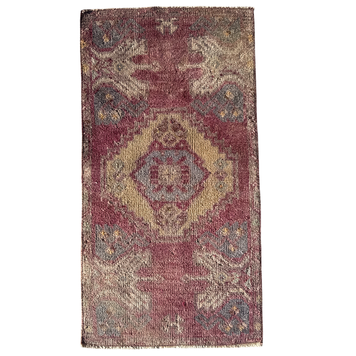 Rectangular rug with a geometric pattern on a white background